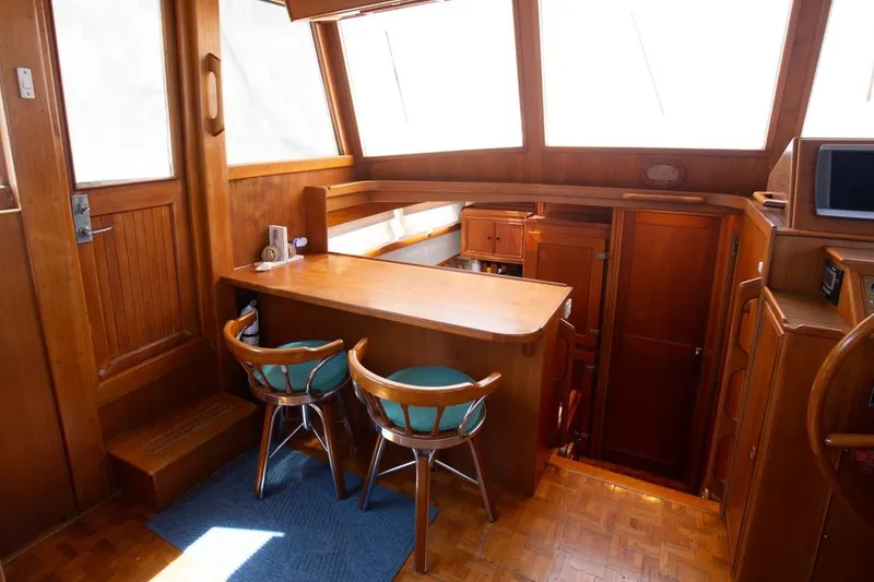 Slide: The Image of 1993 Grand Banks 46 Motoryacht kitchen with wooden cabinetry and dual sink. - 58