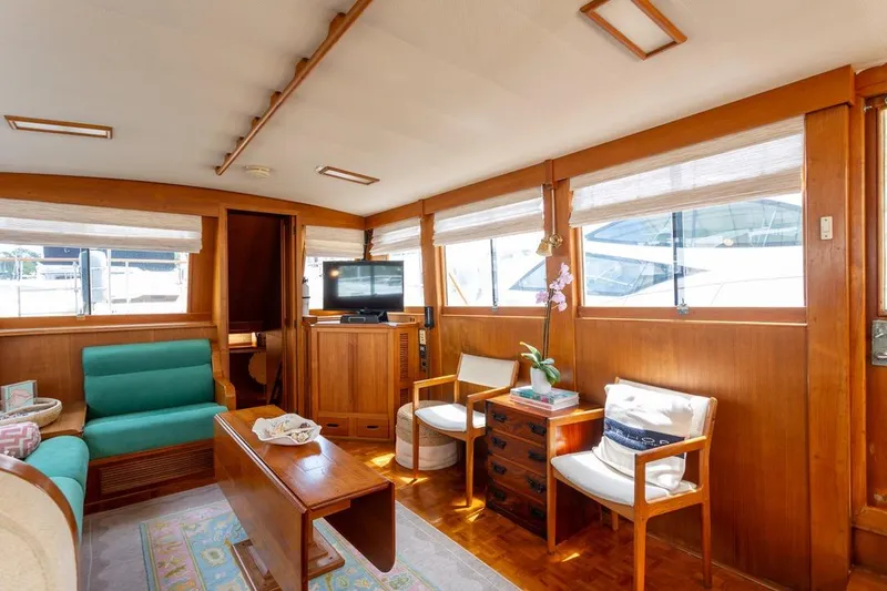 Slide: The Image of Luxurious 1993 Grand Banks 46 Motoryacht interior with elegant wood finishes and comfortable seating. - 62