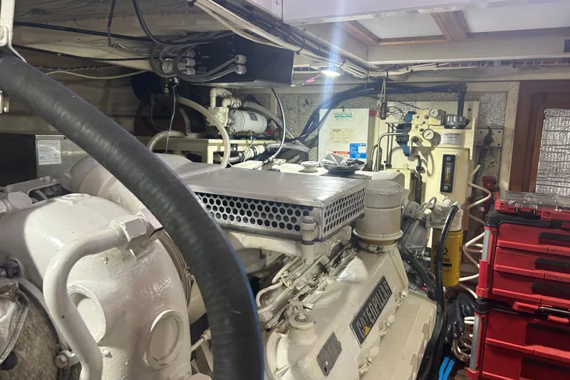 Slide: The Image of Engine room of a 1993 Grand Banks 46 Motoryacht with visible machinery and equipment. - 75