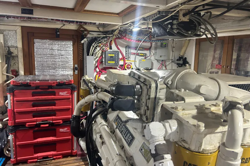 Slide: The Image of Engine room of a 1993 Grand Banks 46 Motoryacht with tools and equipment. - 76