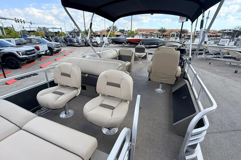 Slide: The Image of 2022 Sun Tracker Fishin' Barge 22 DLX pontoon boat with spacious seating and canopy. - 10