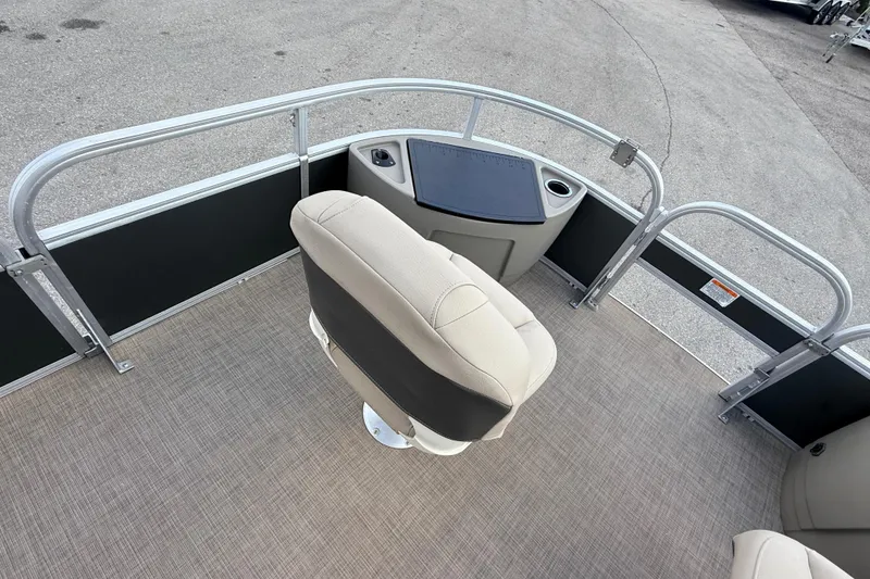 Slide: The Image of 2022 Sun Tracker Fishin' Barge 22 DLX interior with seating and fishing station. - 13