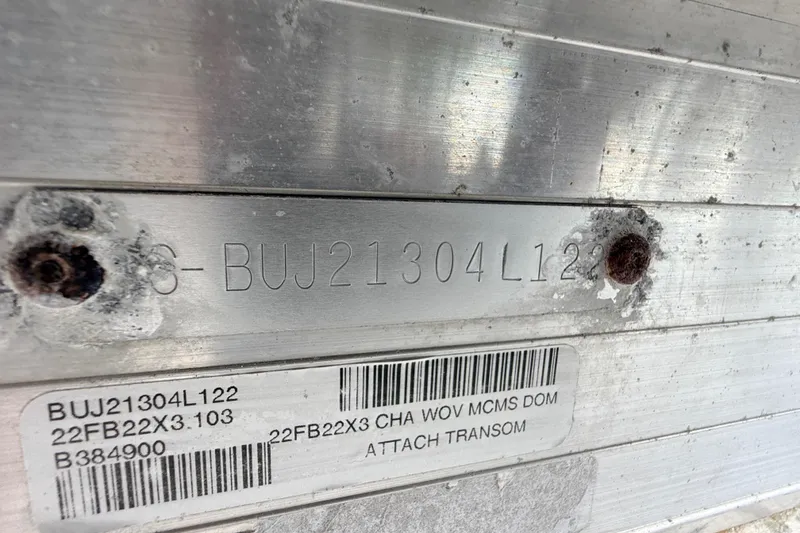 Slide: The Image of 2022 Sun Tracker Fishin' Barge 22 DLX identification plate with serial number and barcode. - 25