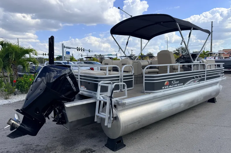 Slide: The Image of 2022 Sun Tracker Fishin' Barge 22 DLX pontoon boat with Mercury outboard motor. - 6