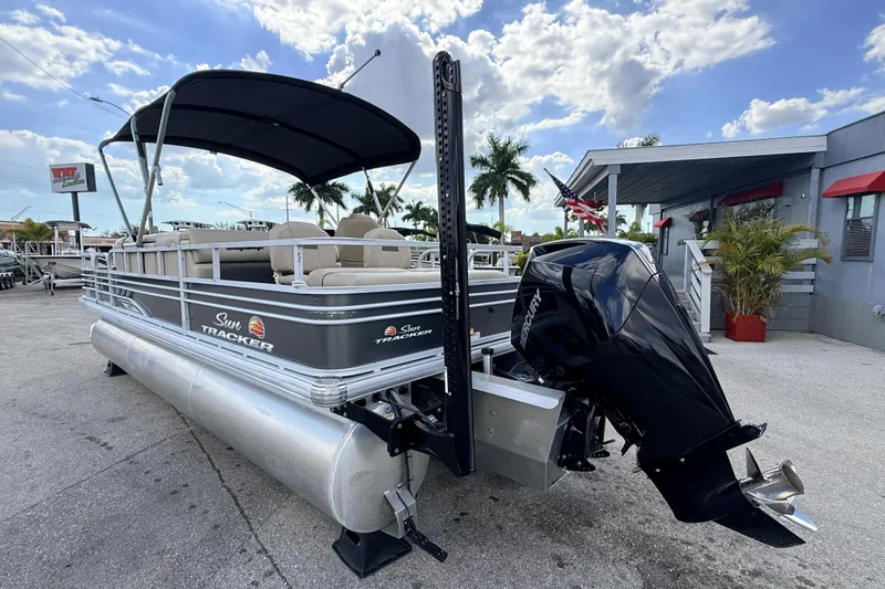 Slide: The Image of 2022 Sun Tracker Fishin' Barge 22 DLX pontoon boat with Mercury outboard motor. - 8