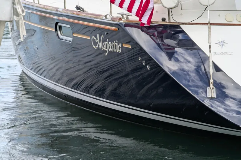 Slide: The Image of Jeanneau Sun Odyssey 54 DS yacht, 2009 model, docked with American flag. - 1
