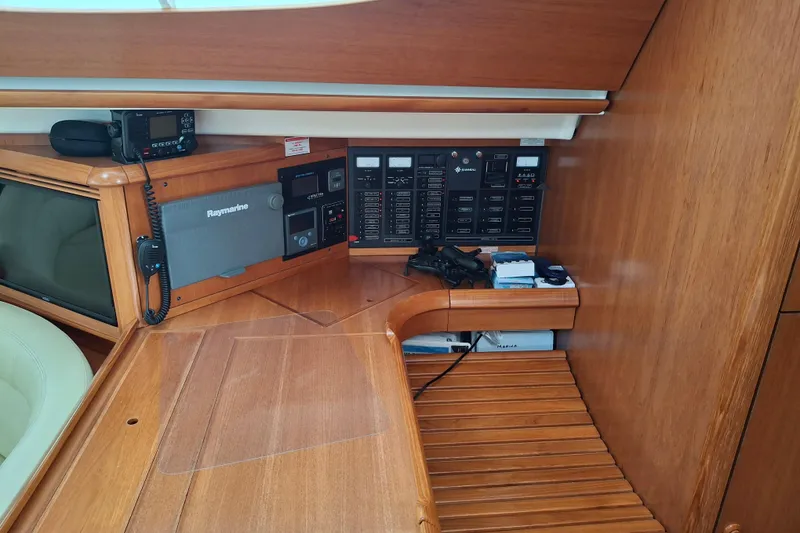 Slide: The Image of Jeanneau Sun Odyssey 54 DS 2009 yacht interior with navigation equipment and control panel. - 12