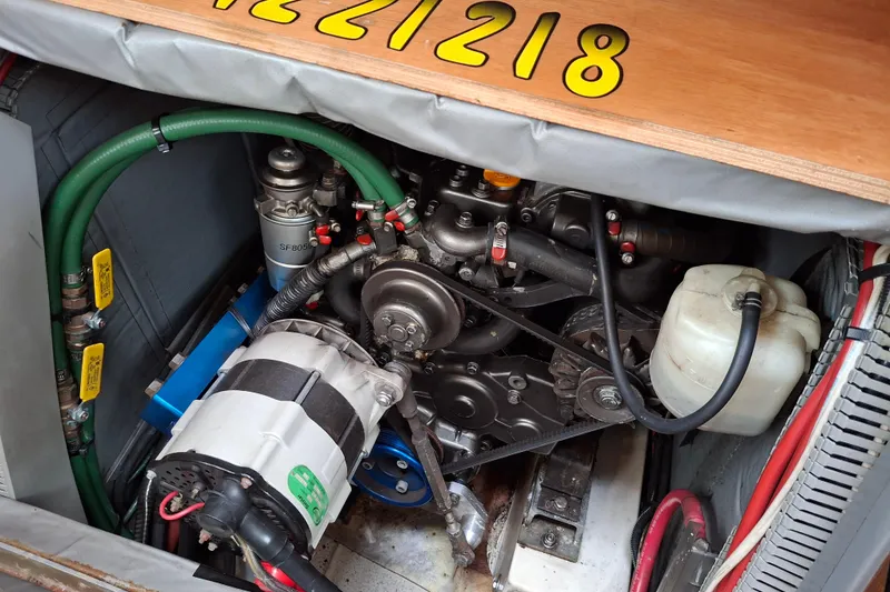 Slide: The Image of Engine compartment of 2009 Jeanneau Sun Odyssey 54 DS sailboat, showing mechanical components. - 19