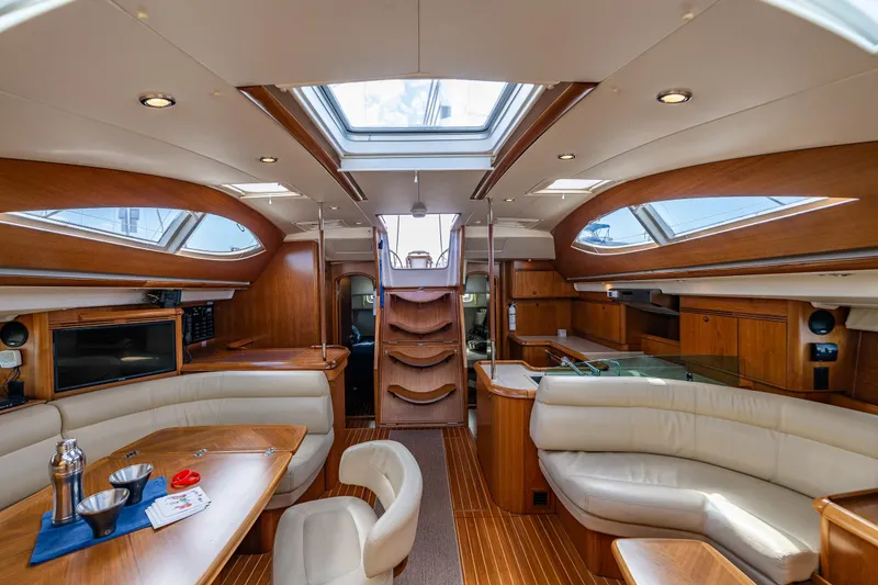 Slide: The Image of Luxurious interior of 2009 Jeanneau Sun Odyssey 54 DS yacht with wooden cabinetry and modern amenities. - 29