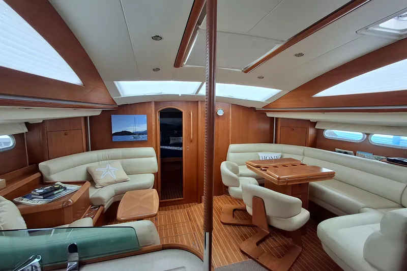 Slide: The Image of Luxurious interior of 2009 Jeanneau Sun Odyssey 54 DS yacht with elegant seating and wood finish. - 3