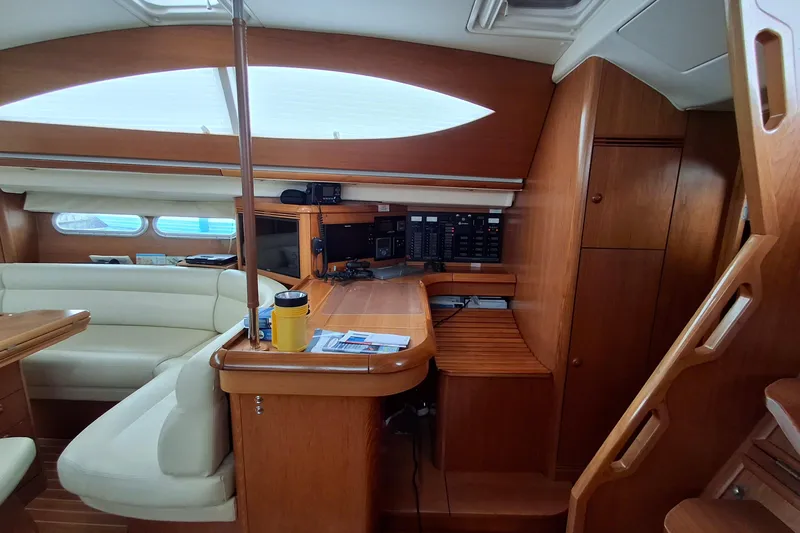 Slide: The Image of Interior of 2009 Jeanneau Sun Odyssey 54 DS yacht with wood finish and navigation equipment. - 4