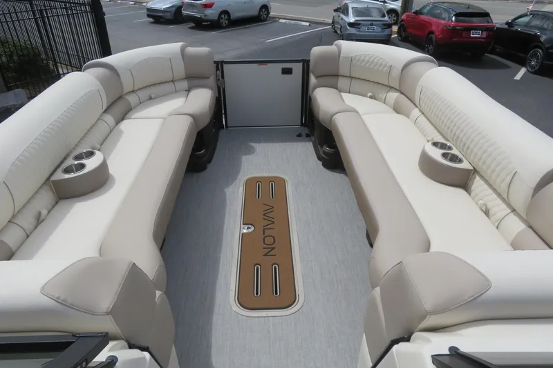 Slide: The Image of Luxurious Avalon Excalibur pontoon boat interior, cream seating, 2026 model. - 21