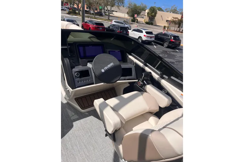 Slide: The Image of Interior of 2026 Avalon Excalibur LTD Quad Lounger with control console. - 7