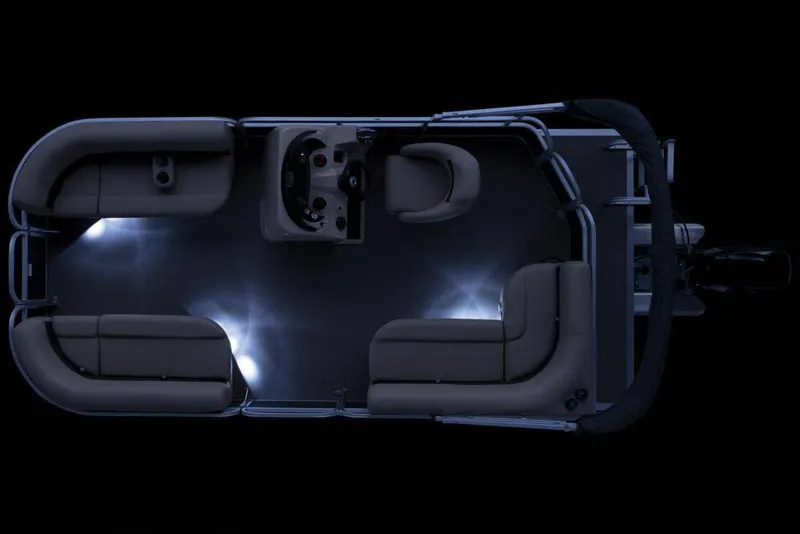 Slide: The Image of 2019 Sun Tracker Party Barge 18 DLX interior with beige seating and speaker. - 22