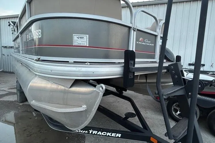 Slide: The Image of 2019 Sun Tracker Party Barge 18 DLX, beige seating, spacious deck, comfortable design. - 23