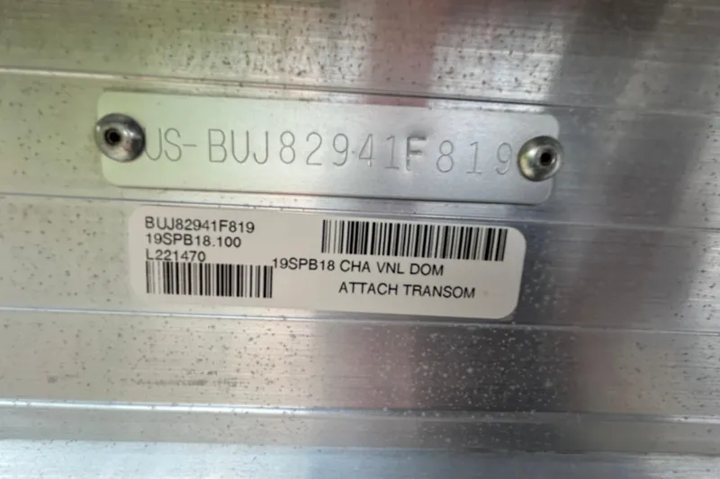 Slide: The Image of 2019 Sun Tracker Party Barge 18 DLX storage compartment with open cushioned seating. - 28