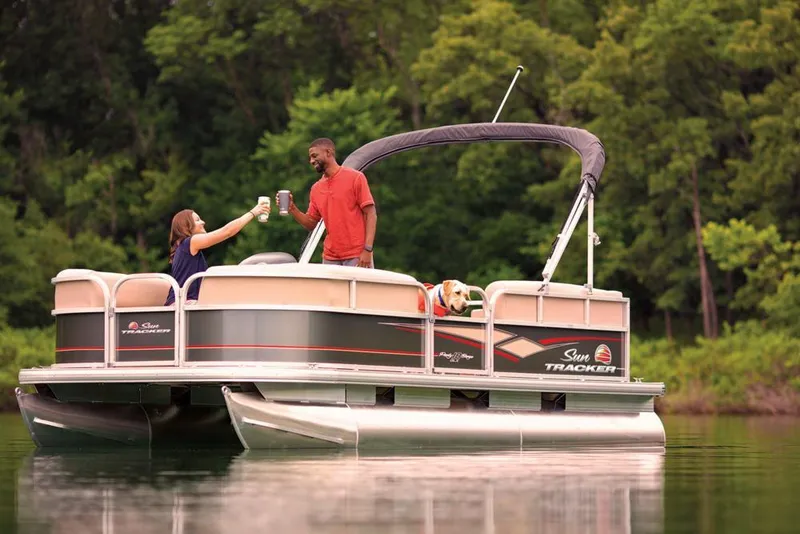 Slide: The Image of 2019 Sun Tracker Party Barge 18 DLX pontoon boat on trailer at dealership. - 4