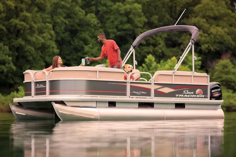 Slide: The Image of 2019 Sun Tracker Party Barge 18 DLX pontoon boat on trailer, side view. - 5