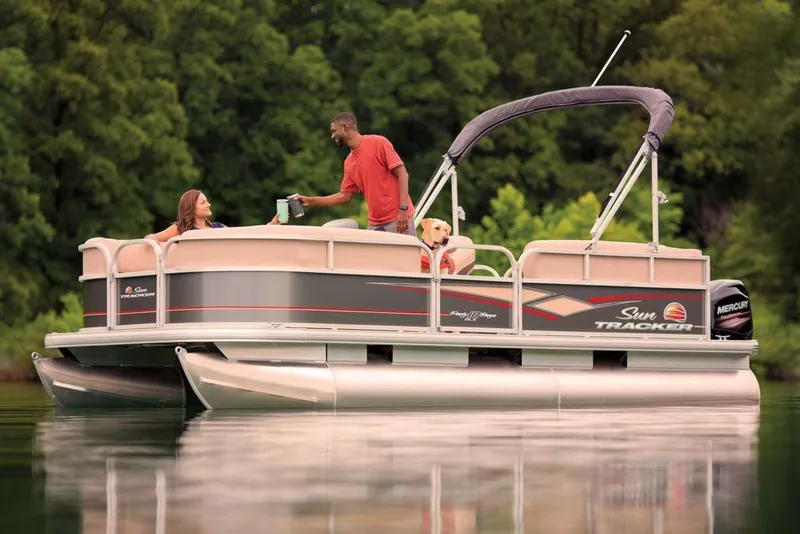 Slide: The Image of 2019 Sun Tracker Party Barge 18 DLX pontoon boat with Mercury outboard motor at sunset. - 9