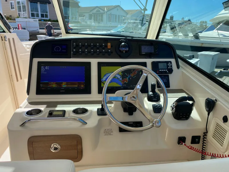 Slide: The Image of 2017 Grady-White Freedom 375 helm with advanced navigation and control systems. - 13