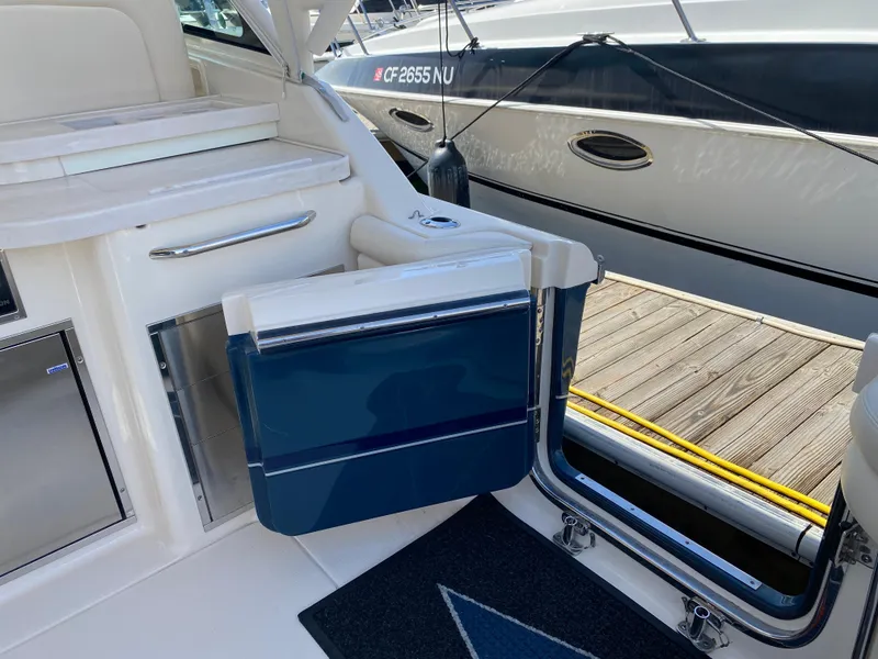 Slide: The Image of 2017 Grady-White Freedom 375 boat interior with open door to dock. - 18