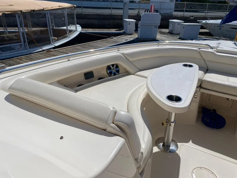 Slide: The Image of 2017 Grady-White Freedom 375 boat interior with seating and table at dock. - 19
