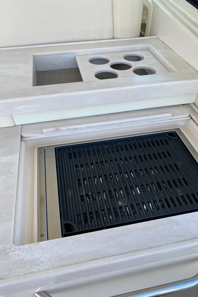 Slide: The Image of Grady-White Freedom 375 2017 boat grill and cup holders on deck. - 27