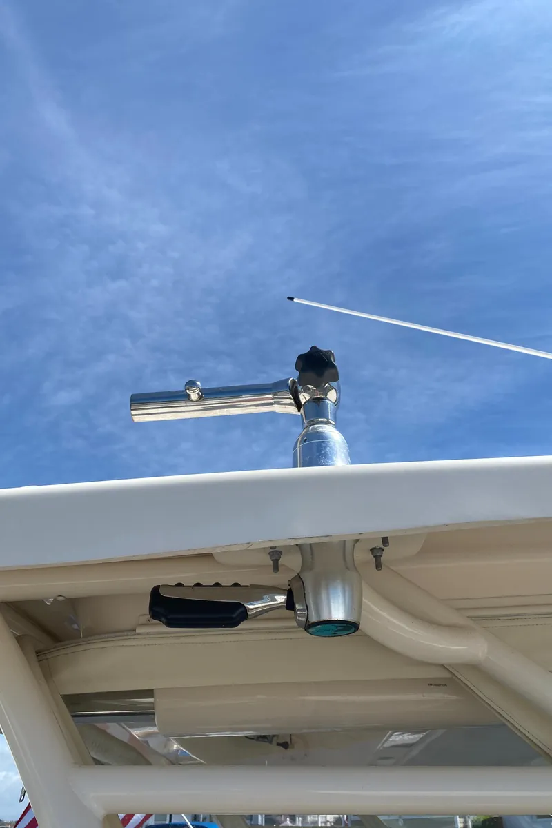 Slide: The Image of Grady-White Freedom 375 boat detail, 2017 model, featuring a metal rod holder against a clear sky. - 29