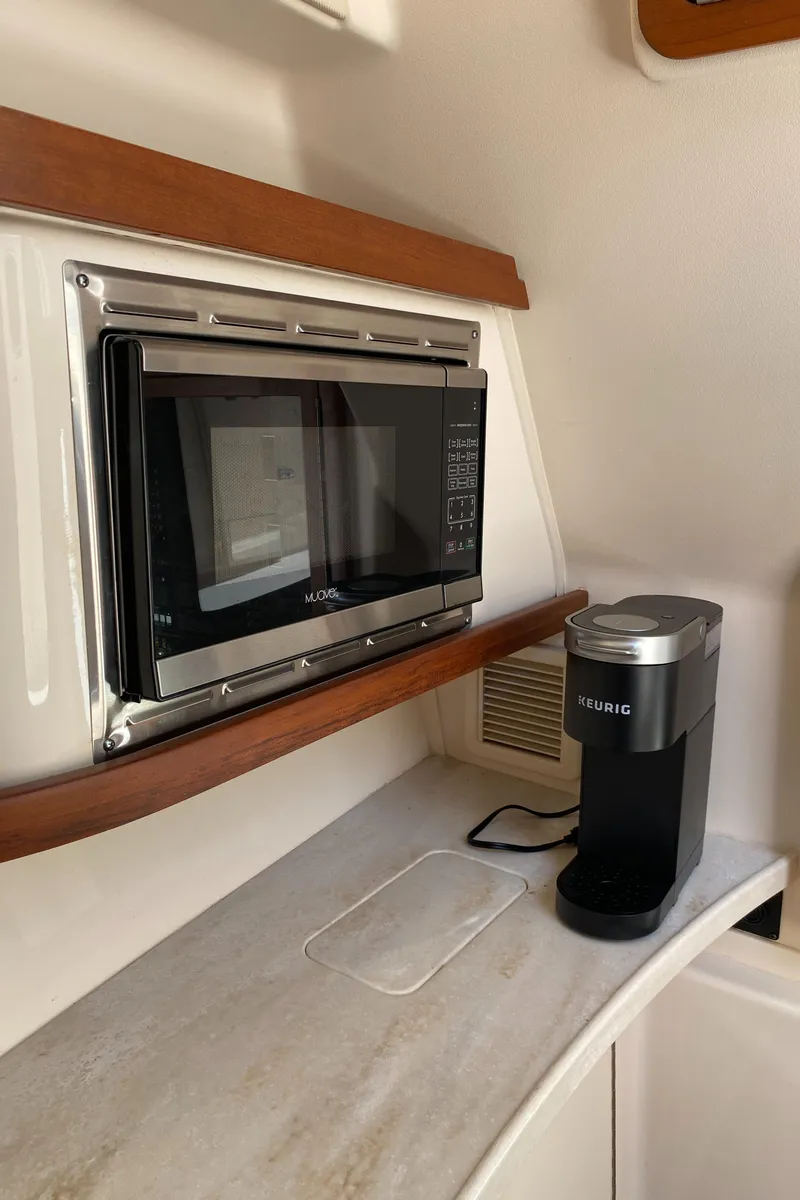 Slide: The Image of 2017 Grady-White Freedom 375 interior with microwave and coffee maker. - 35