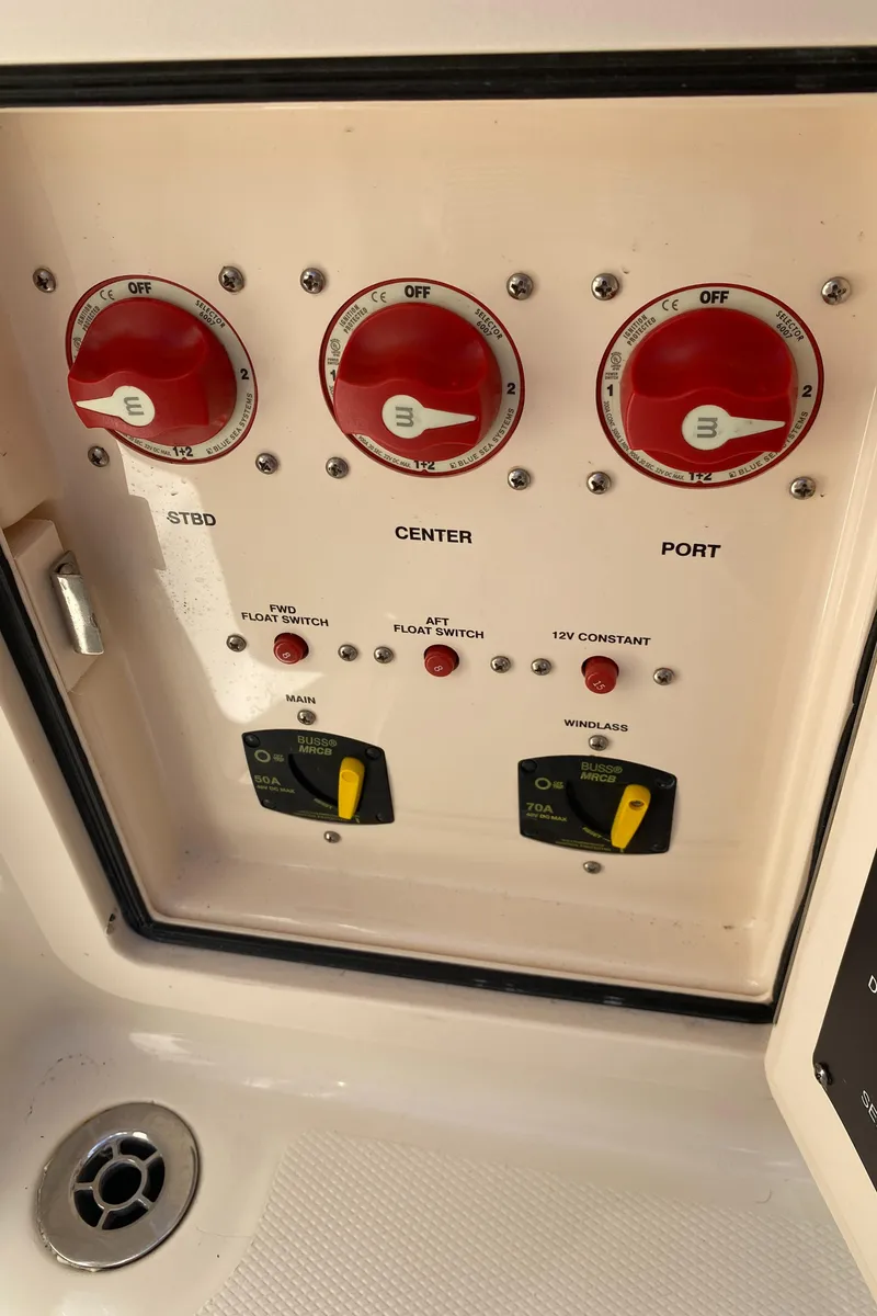 Slide: The Image of Control panel of 2017 Grady-White Freedom 375 boat with switches and dials. - 39