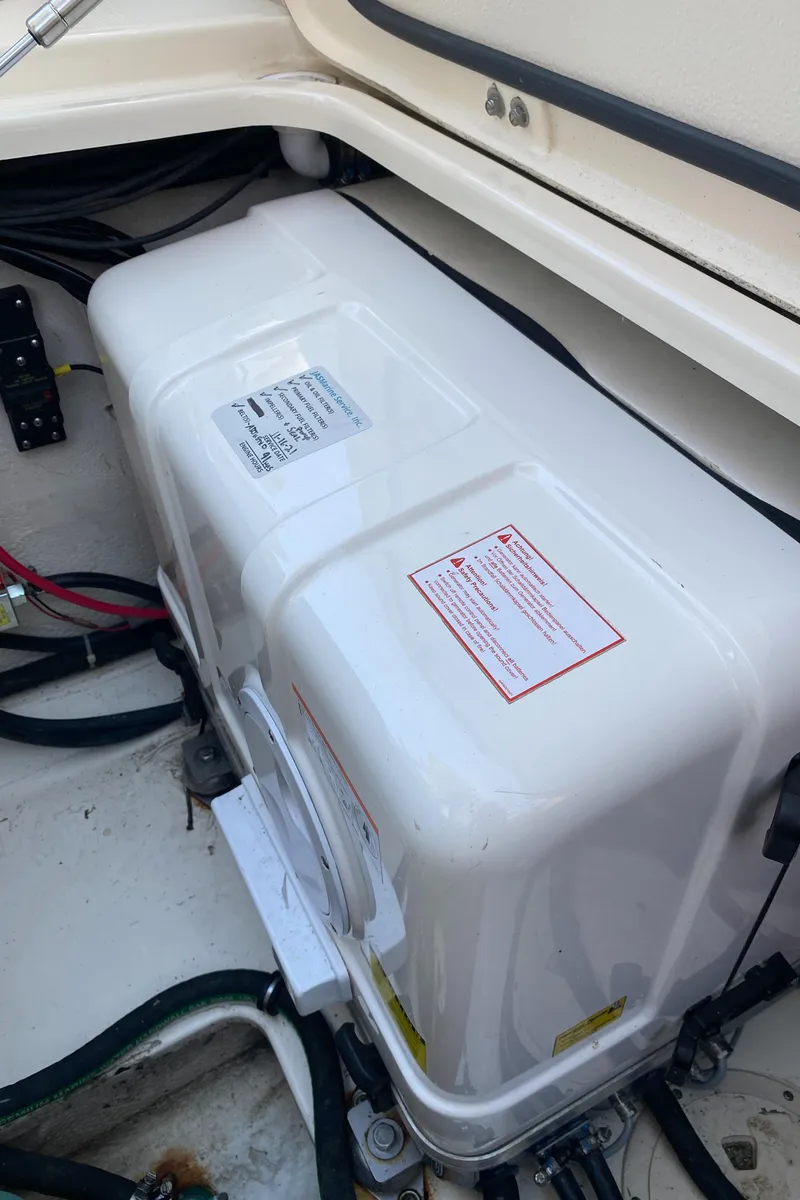 Slide: The Image of 2017 Grady-White Freedom 375 boat compartment with electrical components and wiring. - 41