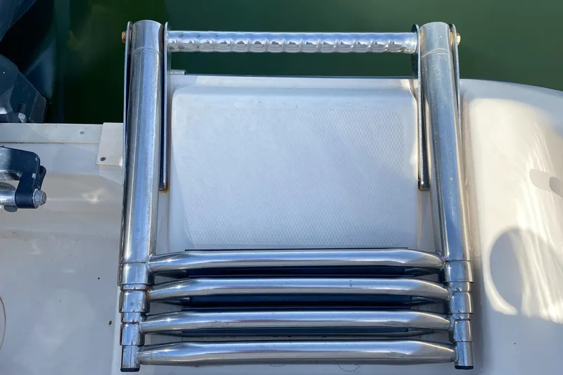 Slide: The Image of Stainless steel boat ladder on 2017 Grady-White Freedom 375, folded on deck. - 9