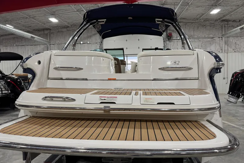 Slide: The Image of 2007 Cobalt 282 boat with teak swim platform in a showroom. - 4