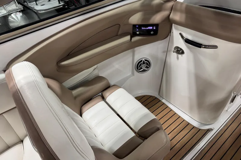 Slide: The Image of Luxurious interior of 2007 Cobalt 282 boat with beige and white seating. - 8