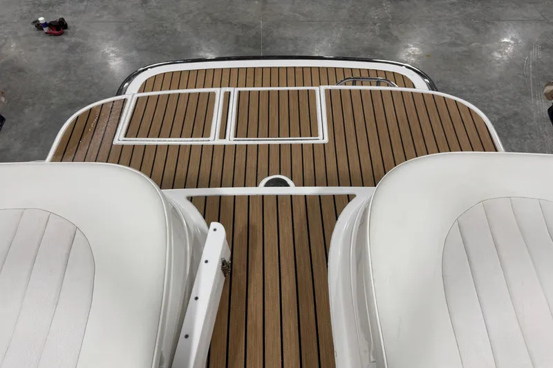 Slide: The Image of 2007 Cobalt 282 boat with teak deck and white seating. - 9
