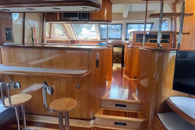 Slide: The Image of Luxurious 2003 Custom Sea Star Pilot House interior with wood finish and modern amenities. - 11