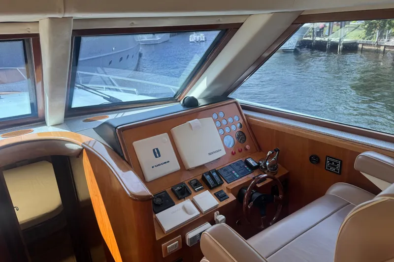 Slide: The Image of Pilot house interior of 2003 Custom Sea Star, featuring navigation equipment and water view. - 14