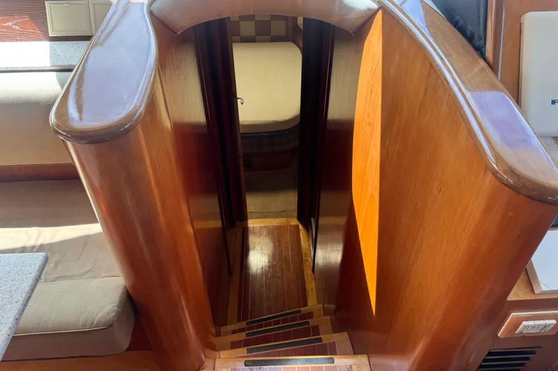 Slide: The Image of Wooden staircase leading to cabin in 2003 Custom Sea Star Pilot House boat. - 17