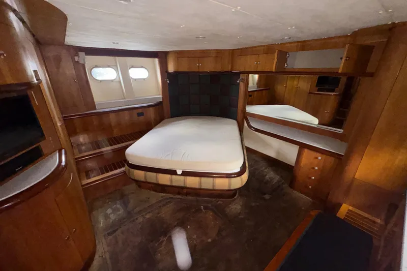Slide: The Image of Luxurious 2003 Custom Sea Star Pilot House cabin with wood interior and cozy bed. - 20