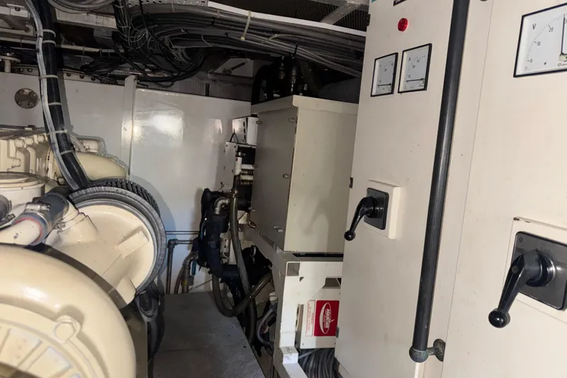 Slide: The Image of Engine room of 2003 Custom Sea Star Pilot House with control panels and machinery. - 29