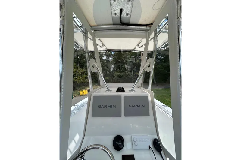 Slide: The Image of 1998 Contender 21 Open boat console with dual Garmin displays and steering wheel. - 6