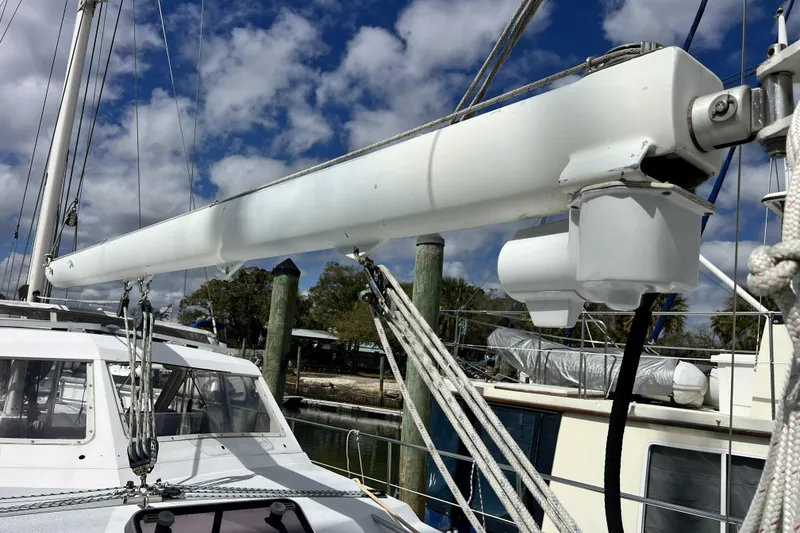 Slide: The Image of 1986 Amel Mango sailboat mast and rigging against a cloudy sky. - 4