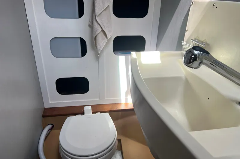 Slide: The Image of Compact bathroom in 1986 Amel Mango yacht with toilet and sink. - 44
