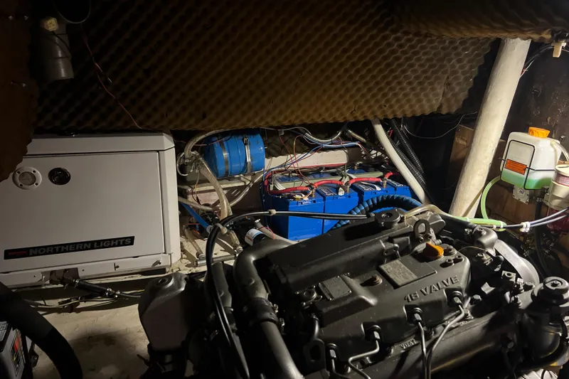 Slide: The Image of Engine room of 1986 Amel Mango sailboat with Northern Lights generator and wiring. - 48