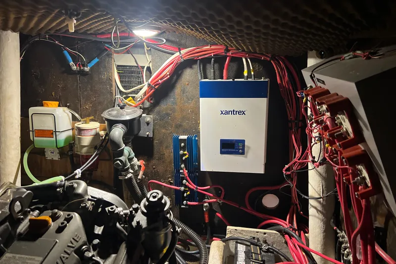 Slide: The Image of Engine room of 1986 Amel Mango sailboat with Xantrex inverter and wiring. - 49