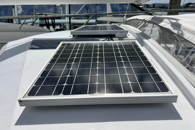 Slide: The Image of Solar panels on 1986 Amel Mango yacht deck, harnessing renewable energy. - 52