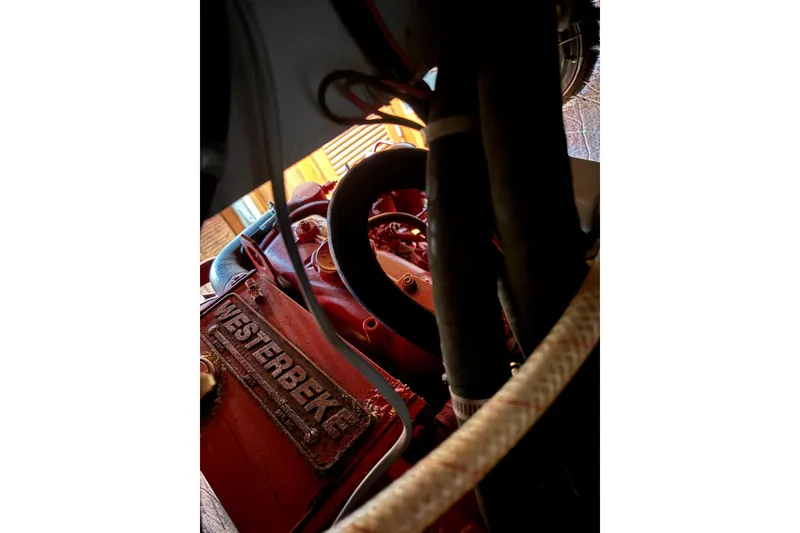 Slide: The Image of Deck of 1985 Mason 33 sailboat with ropes and textured surface. - 11