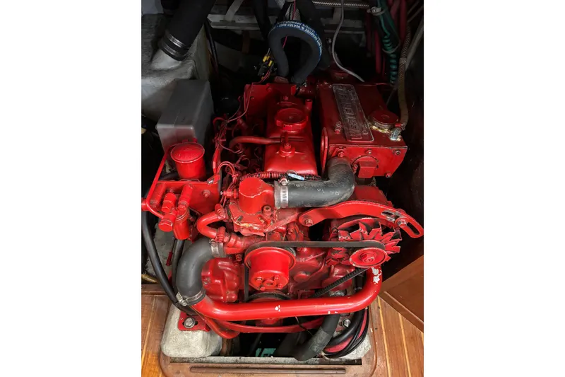 Slide: The Image of Red Mason 33 engine from 1985, detailed view with hoses and components. - 25