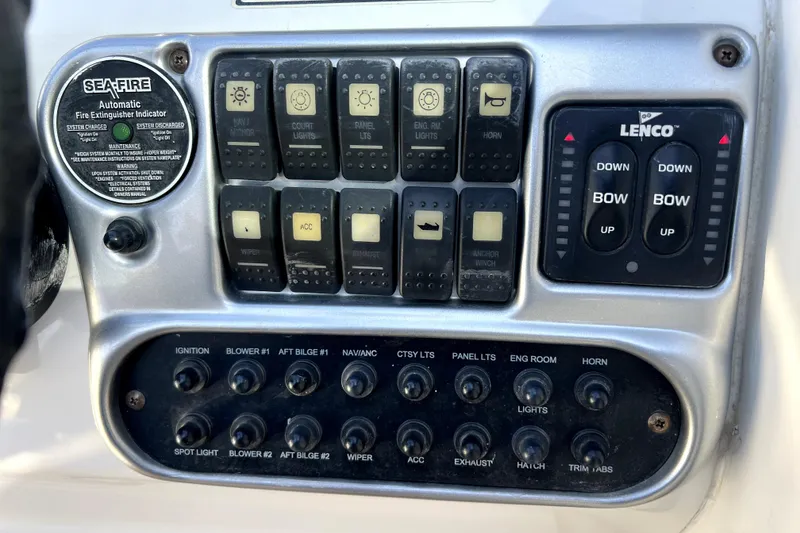 Slide: The Image of Control panel of a 2004 Crownline 250 CR boat with switches and indicators. - 22