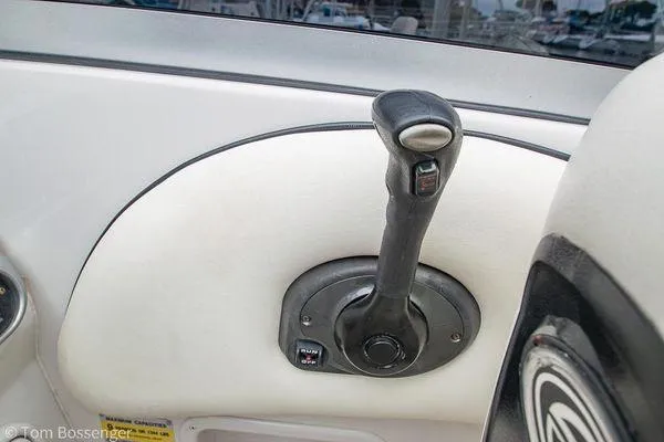 Slide: The Image of Throttle control of a 2004 Crownline 250 CR boat, featuring a sleek design. - 35